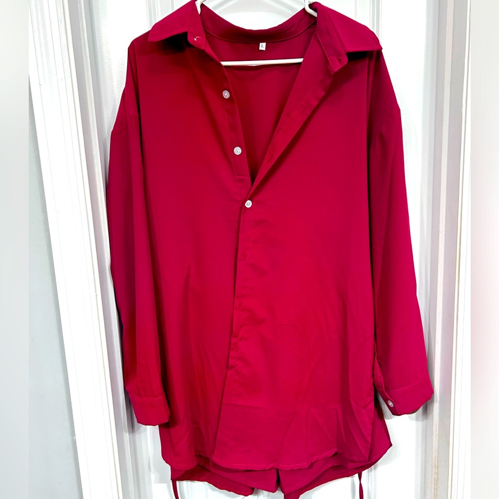 Large button up dress with shorts.